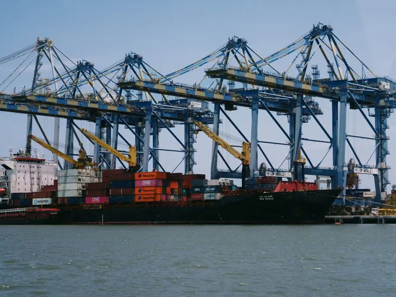 Container ship at an Indian port with cranes